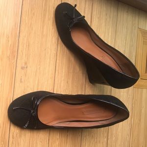 Black leather wedge pump